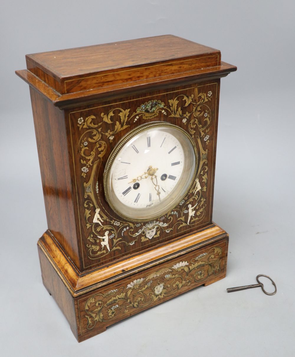 A 19th century French inlaid rosewood cased eight day mantel clock, with brass, mother of pearl and bone inlay, height 31cm